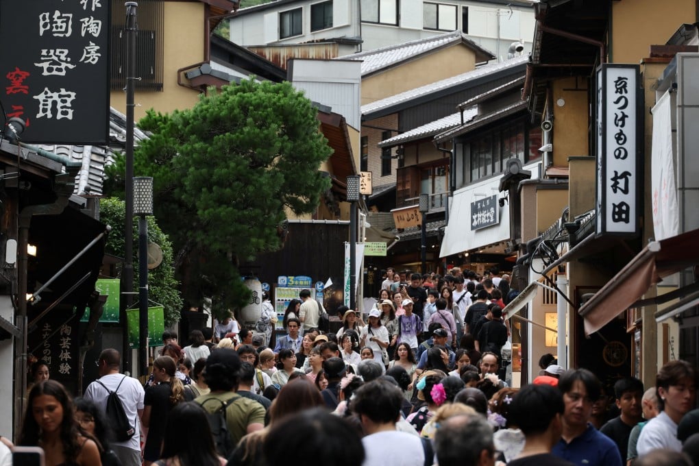 Visitors crowd a street leading to Kiyomizu Temple in Kyoto, Japan. A 2024 study by the Kyoto city government found that 56.06 million people visited over the course of the year. Photo: Reuters