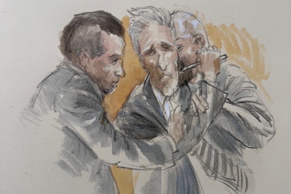 Ryan Routh (centre) tries to stab himself in the neck with a pen in Fort Pierce, Florida, on Tuesday. Courtroom sketch: Lothar Speer via Reuters