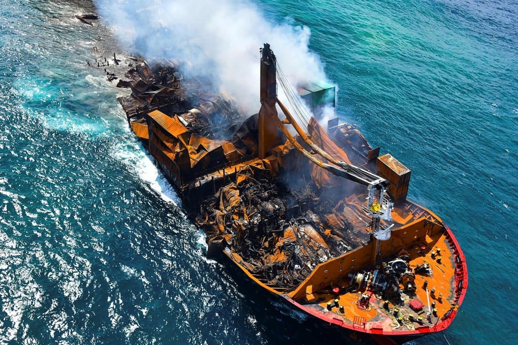 Smoke billows from the Singapore-registered container ship MV X-Press Pearl as its towed away from the coast of Colombo in June 2021. Photo: Sri Lanka Air Force/AFP