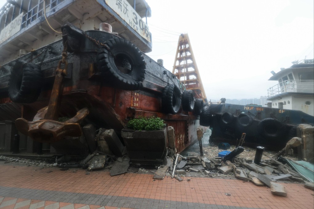 A barge is washed aground at Hung Hom promenade, damaging the embankment near Laguna Verde. Photo: Nora Tam