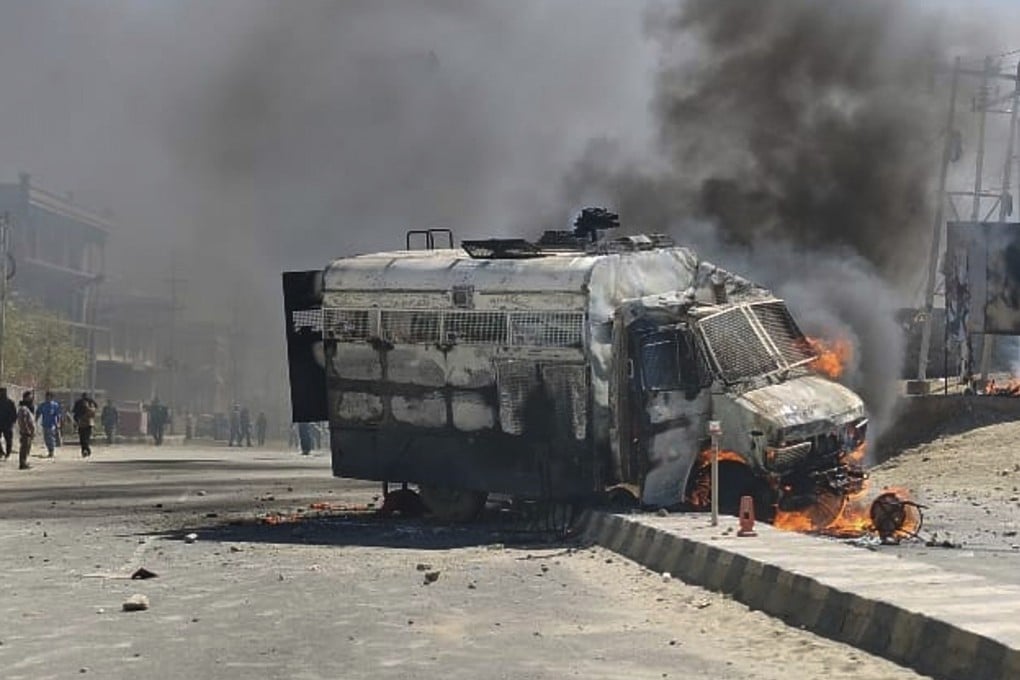 A police vehicle is set on fire during a protest by locals demanding federal statehood from the Indian government in the region of Ladakh on Wednesday. Photo: AP
