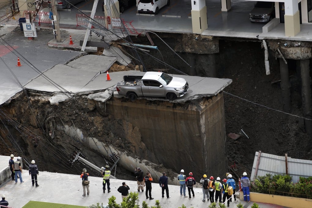 Thai officials inspect a sinkhole in Bangkok on Wednesday. Photo: EPA