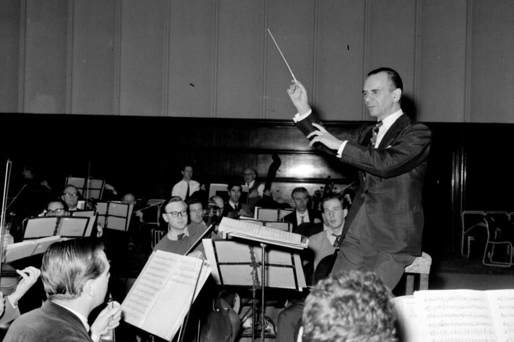 Malcolm Sargent in a final rehearsal with members of the London Philharmonic Orchestra in Hammersmith Town Hall, in preparation for the orchestra’s Asia tour. Photo: PA Images via Getty Images