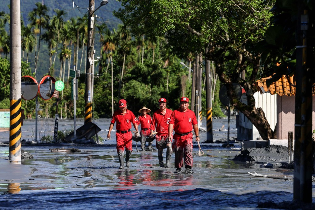 A rescue team looks for flood victims in Hualien on Thursday following torrential rain. The disaster has sparked political hostilities and accusations that fatalities could have been avoided. Photo: AFP