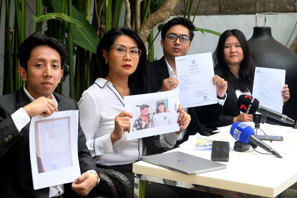 The legal team for the family of Australian national Byron Haddow hold up documents during a press conference at Tibubeneng Badung regency on Indonesia’s resort island of Bali on Wednesday. Photo: AFP
