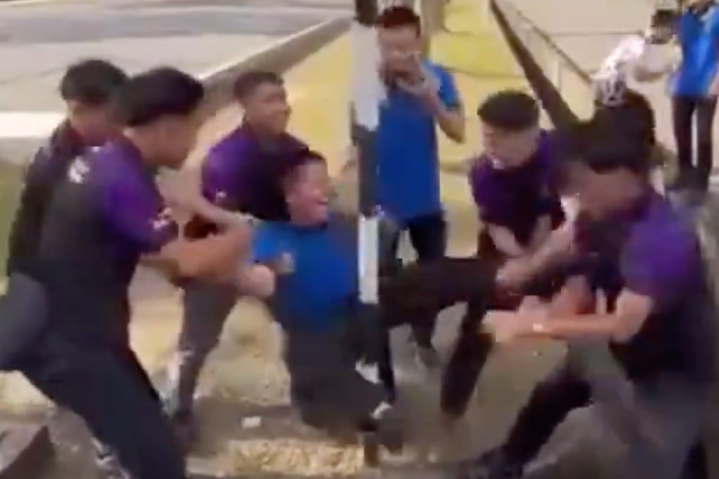 National Youth Skills Institute students in Miri, Sarawak, bump a schoolmate’s groin against a pole in what is known as a ‘Happy Corner’ prank in a video that has gone viral. Photo: Handout