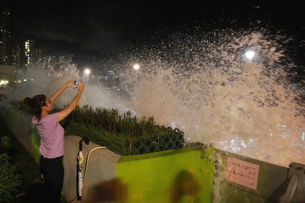 People watch the waves hitting the coast at the Heng Fa Chuen waterfront as Super Typhoon Ragasa approaches Hong Kong, on September 23, 2025. Photo: Elson Li