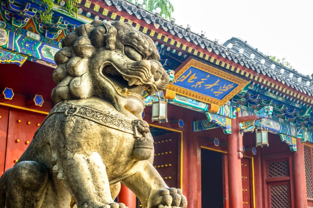 A stone lion stands guard at the west gate of Peking University in Beijing. Lions have long been important symbols of power and authority in China, and also speak to the country’s centuries-old links with the West. Photo: Shutterstock