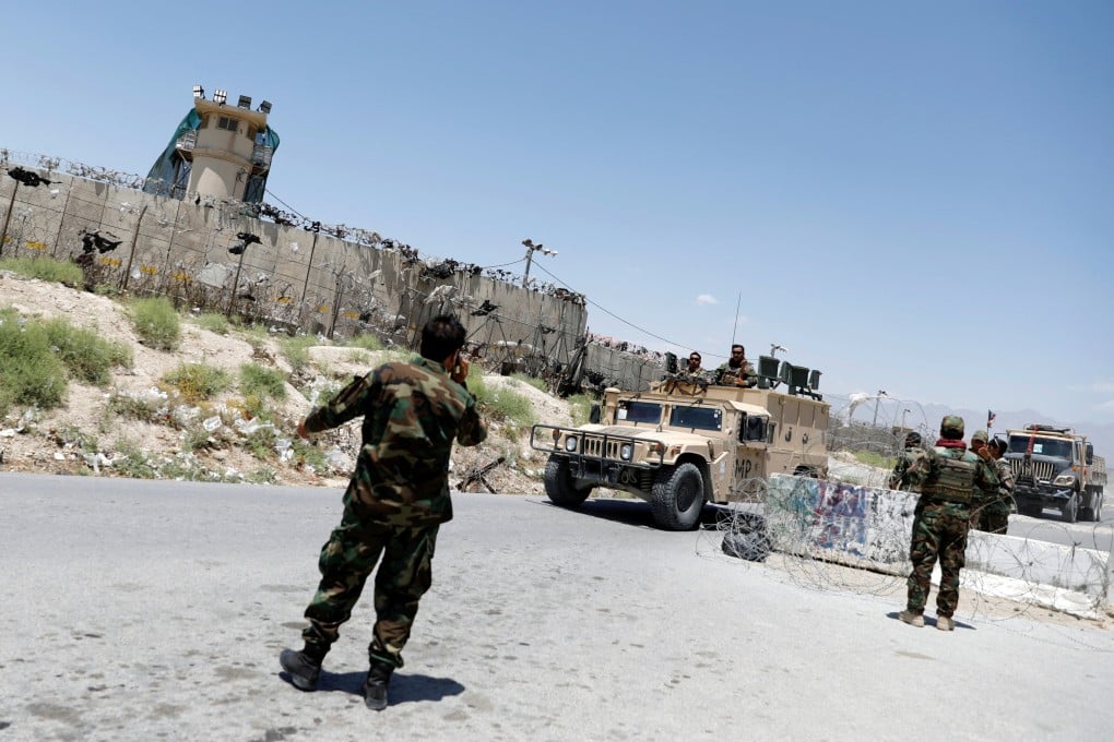 Afghan soldiers stand guard at a checkpoint outside Bagram airbase as the last American troops vacated it in 2021. Recent remarks by US President Donald Trump about a bid to reclaim the base have stirred unease among several countries, including China. Photo: Reuters