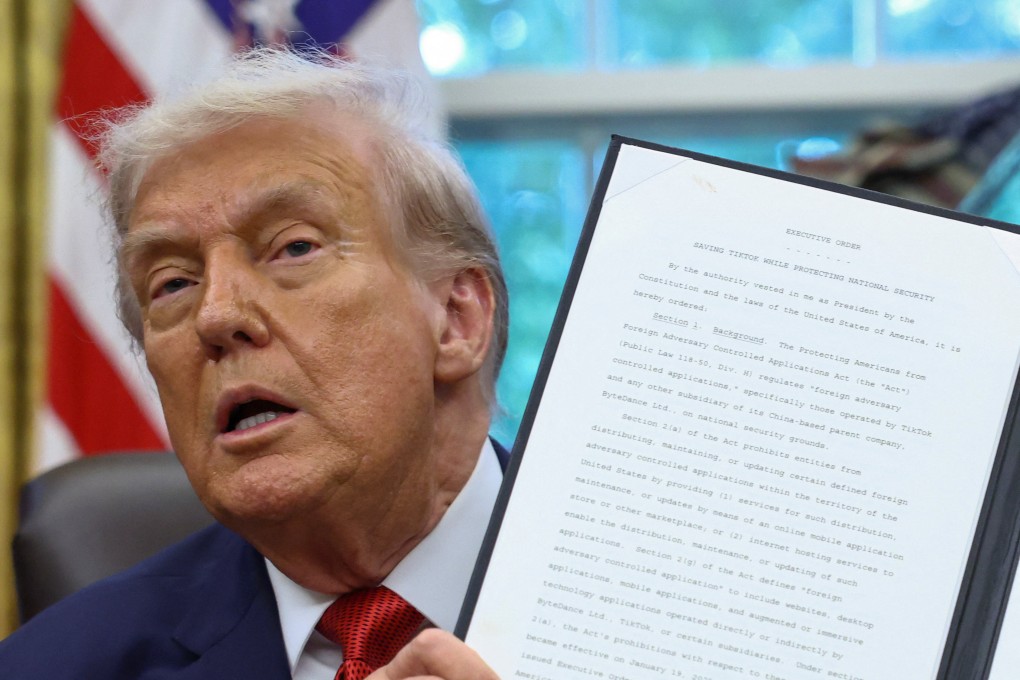 US President Donald Trump shows a signed executive order on a deal that would divest TikTok’s US operations from its Chinese owner, ByteDance, at the White House on Thursday. Photo: Reuters