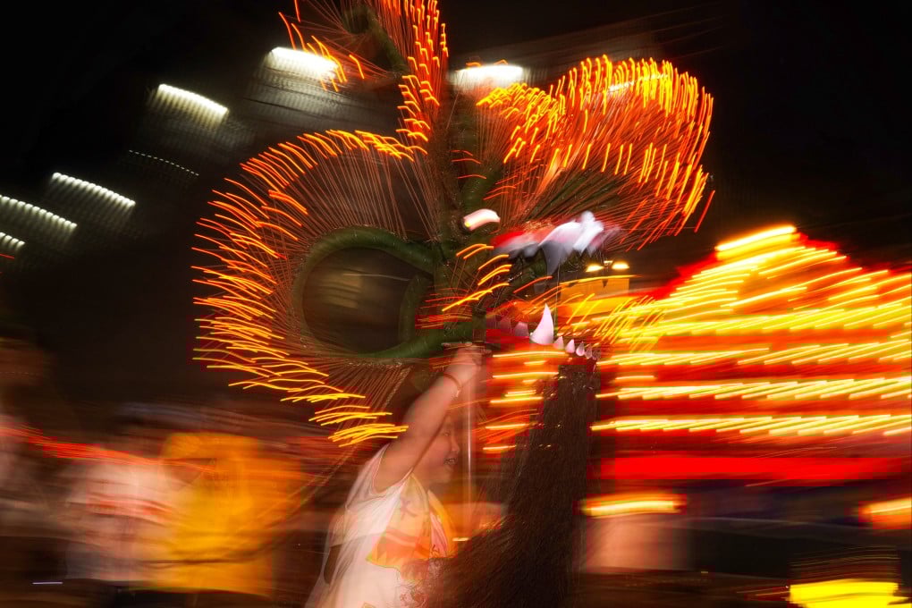 Students play with an LED dragon along the streets of Tai Hang in September 2024. Photo: Elson Li