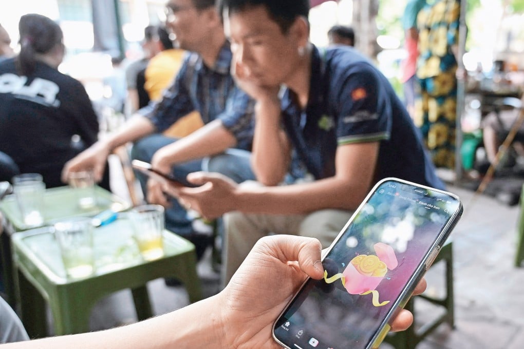 A man watches a TikTok video on his smartphone in Hanoi. Photo: AFP