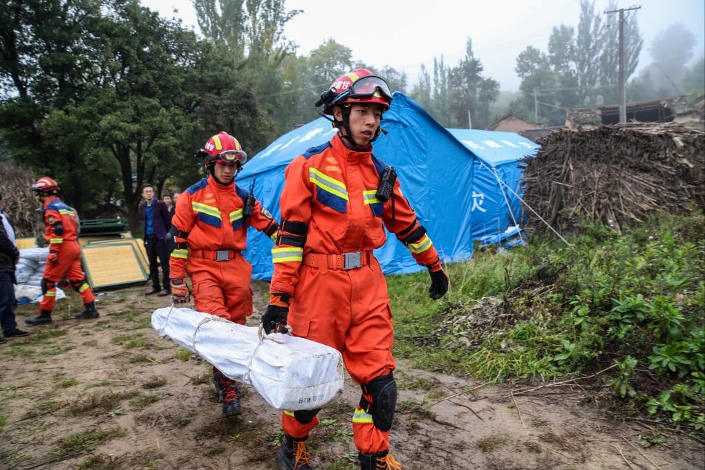 Rescue teams transfer disaster relief supplies to quake-hit Longxi county in China’s northwestern Gansu province on Saturday. Photo: Xinhua