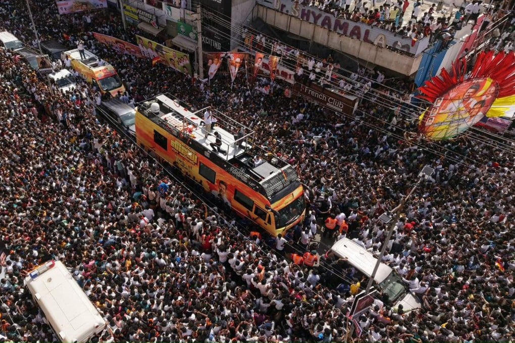 Actor-turned-politician Vijay addresses supporters from an open bus during a rally in Karur, India, on Saturday. Photo: dpa/TNS