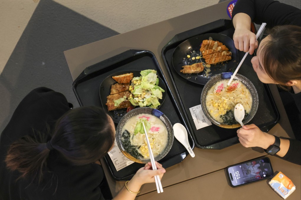 Lunchtime diners tuck into noodles at a Tsim Sha Tsui food court. Photo: Jelly Tse