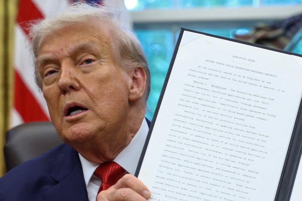 US President Donald Trump shows a signed executive order on a deal that would divest TikTok’s US operations from its Chinese owner ByteDance, at the White House in Washington on September 25. Photo: Reuters