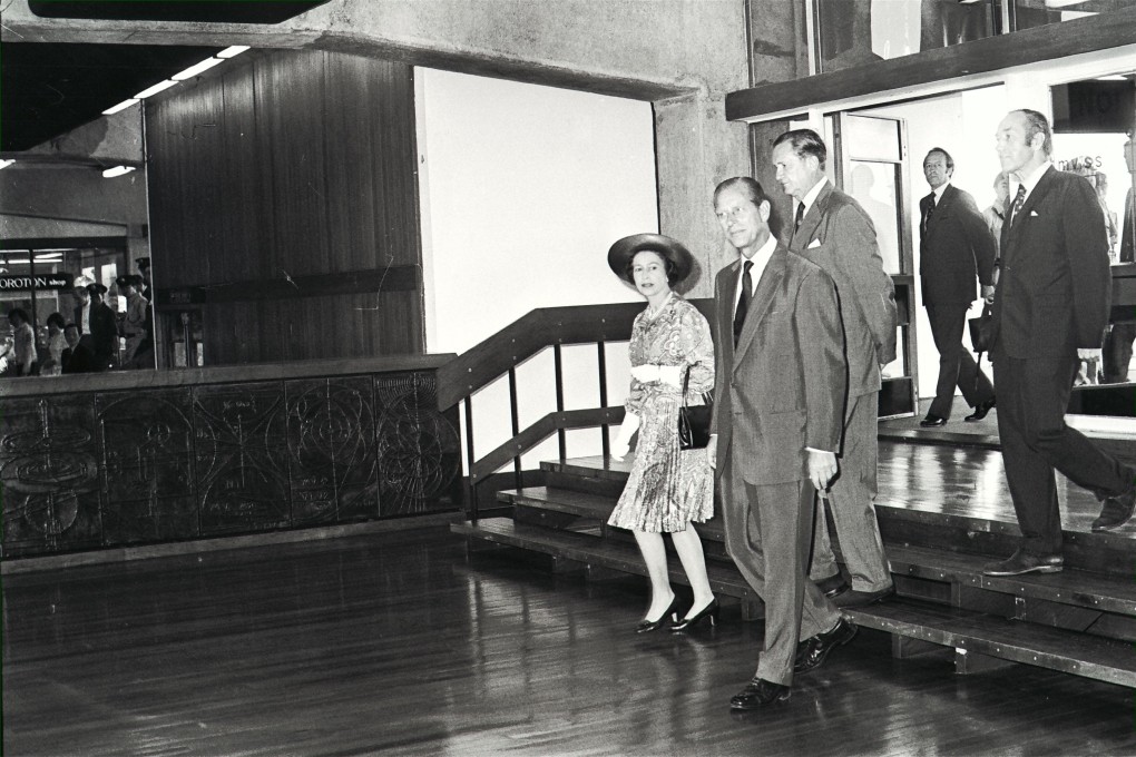 Britain’s Queen Elizabeth and Prince Philip tour Ocean Terminal in 1975. Immediately behind them is Governor Murray MacLehose. Photo: SCMP Archives