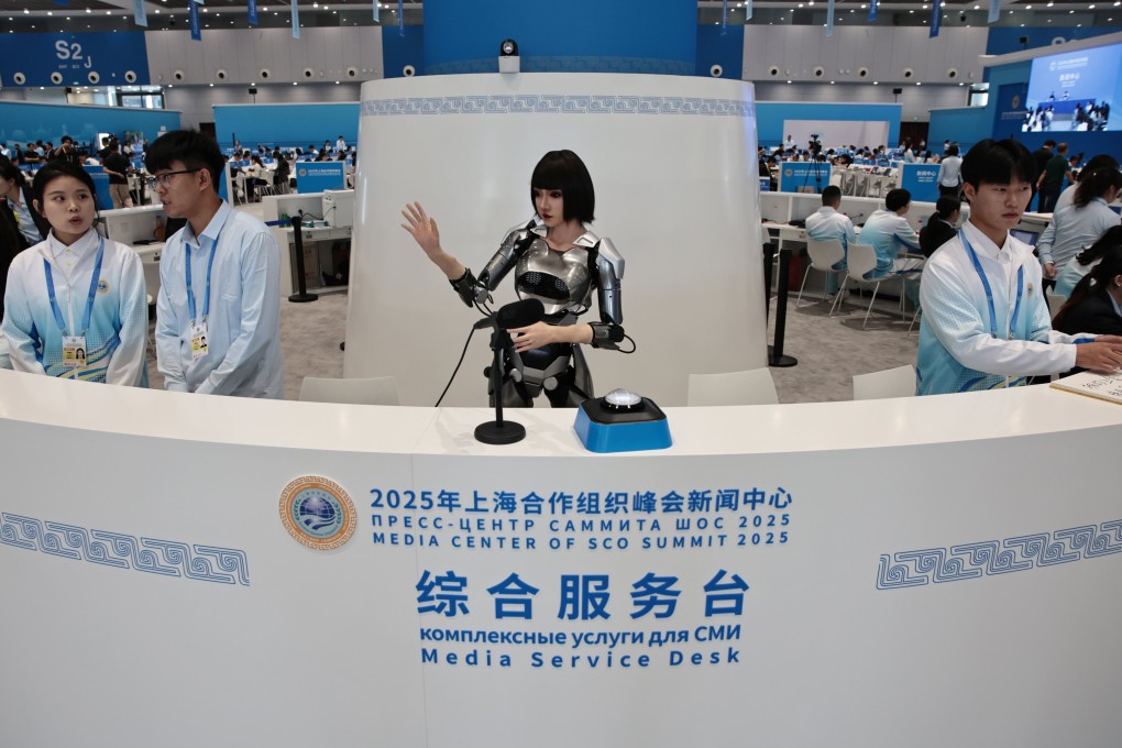 A humanoid robot gestures at the media centre of the Shanghai Cooperation Organisation summit 2025 in Tianjin, China, on August 30. Humanoid robots are being mass-produced in China at comparable quality but much lower prices than in the US. Photo: EPA