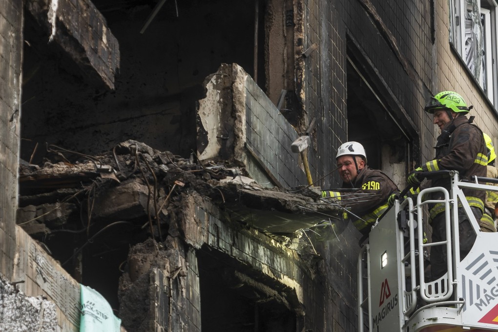 Rescuers work at the site of a Russian strike on a residential building in Kyiv, Ukraine, on Sunday. Photo: EPA