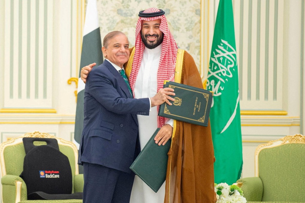 Saudi Crown Prince Mohammed bin Salman and Pakistan’s Prime Minister Shehbaz Sharif embrace after signing a defence agreement in Riyadh, Saudi Arabia, on September 17. Photo: Saudi Press Agency/Reuters