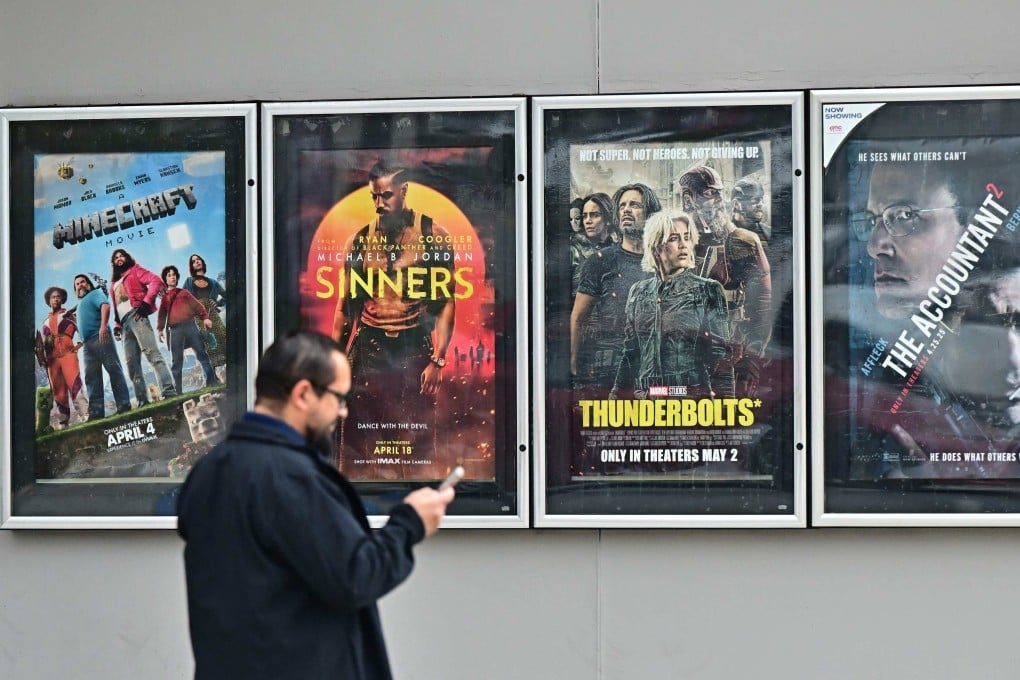 A man walks past movie posters at at AMC Theater in Montebello, California. Studio executives said earlier this year that they were “flummoxed” by how a movie tariff might be enforced. Photo: AFP