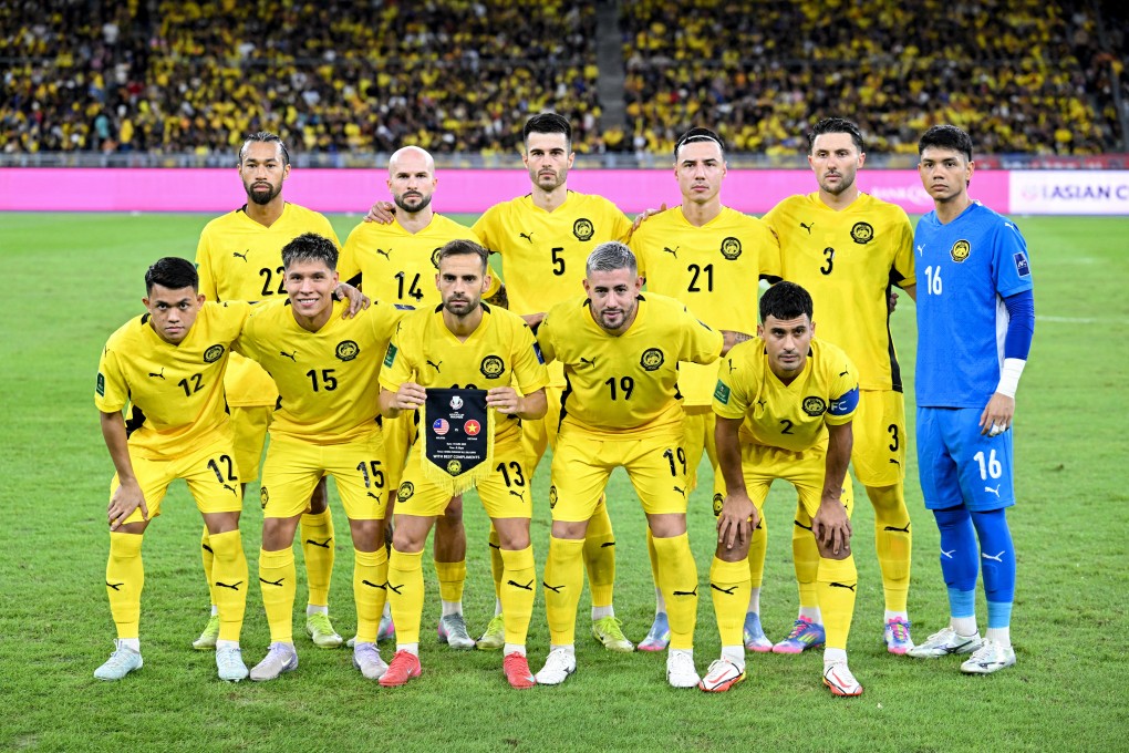 Malaysia’s players pose before the start of an AFC Asian Cup qualifier match against Vietnam on June 10 in Kuala Lumpur. Photo: AFP