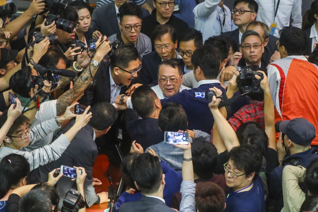 Abraham Razack (centre) is surrounded by other legislators, including Lam Cheuk-ting (left), during chaos in Legco in May 2019. Photo: Edmond So