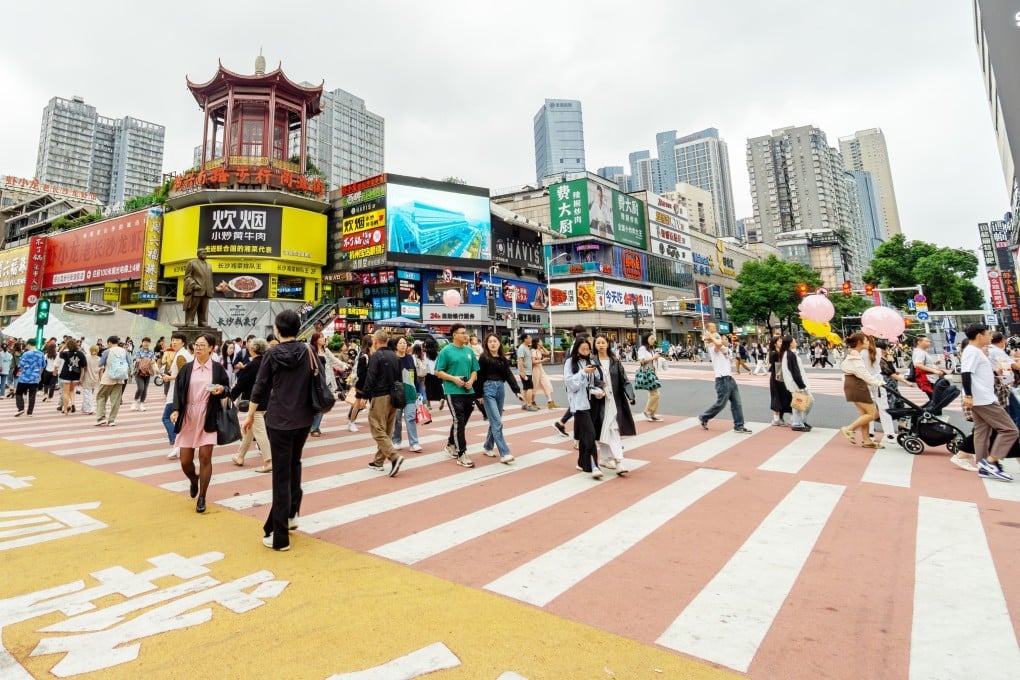 People walk through the streets of Changsha, the capital of China’s Hunan province, last week. Hunan authorities are tightening controls on non-tax revenue growth. Photo: Shutterstock