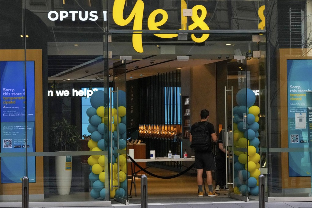 A customer waits for service at an Optus store in Sydney, Australia. Photo: AP