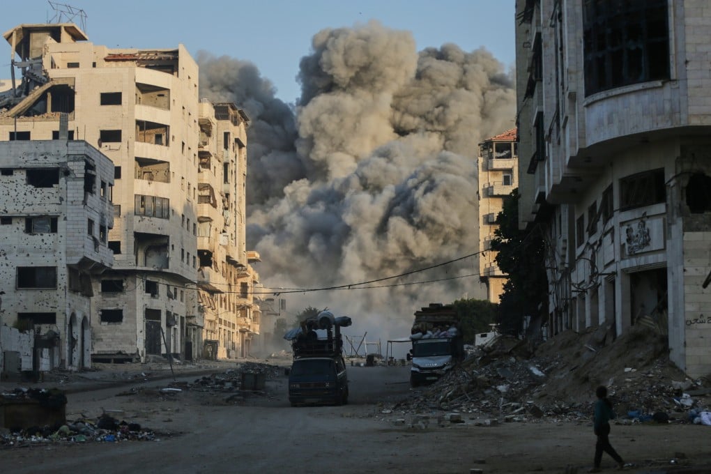 Smoke rises from an Israeli air strike on the Macca Tower, a high-rise building in Gaza City on Sunday. Photo: AP