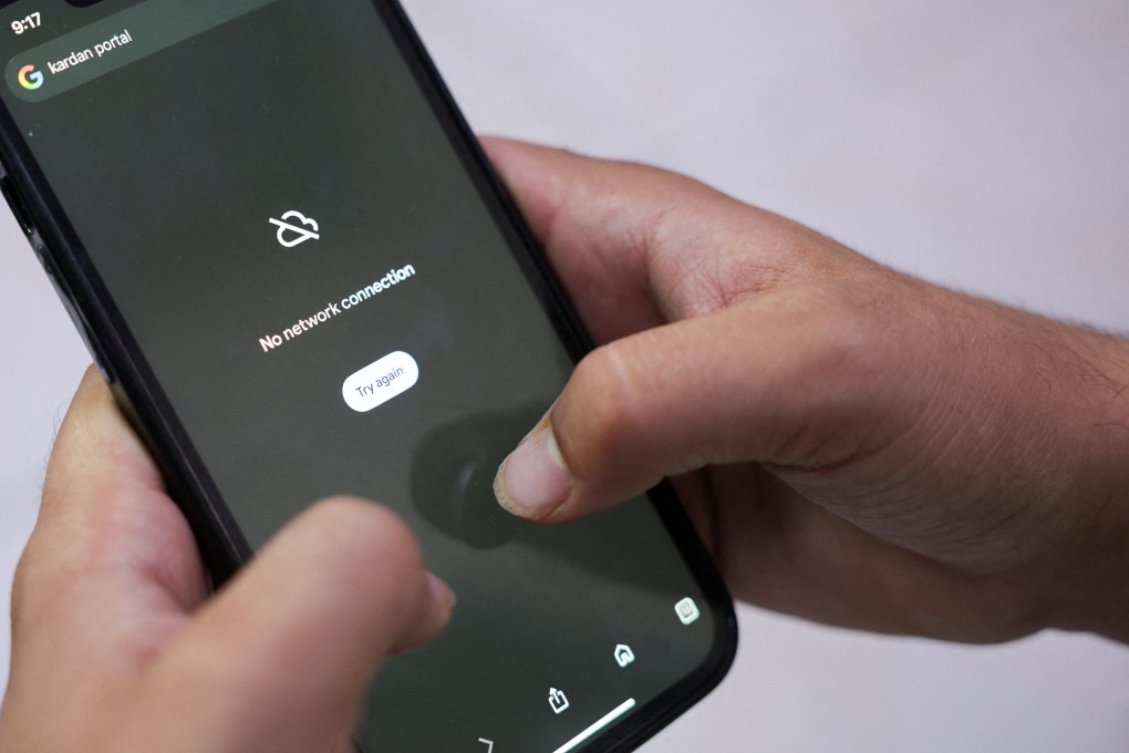 A man tries to use Google on his smartphone amid a total telecom shutdown across Afghanistan on Tuesday. Photo: Reuters