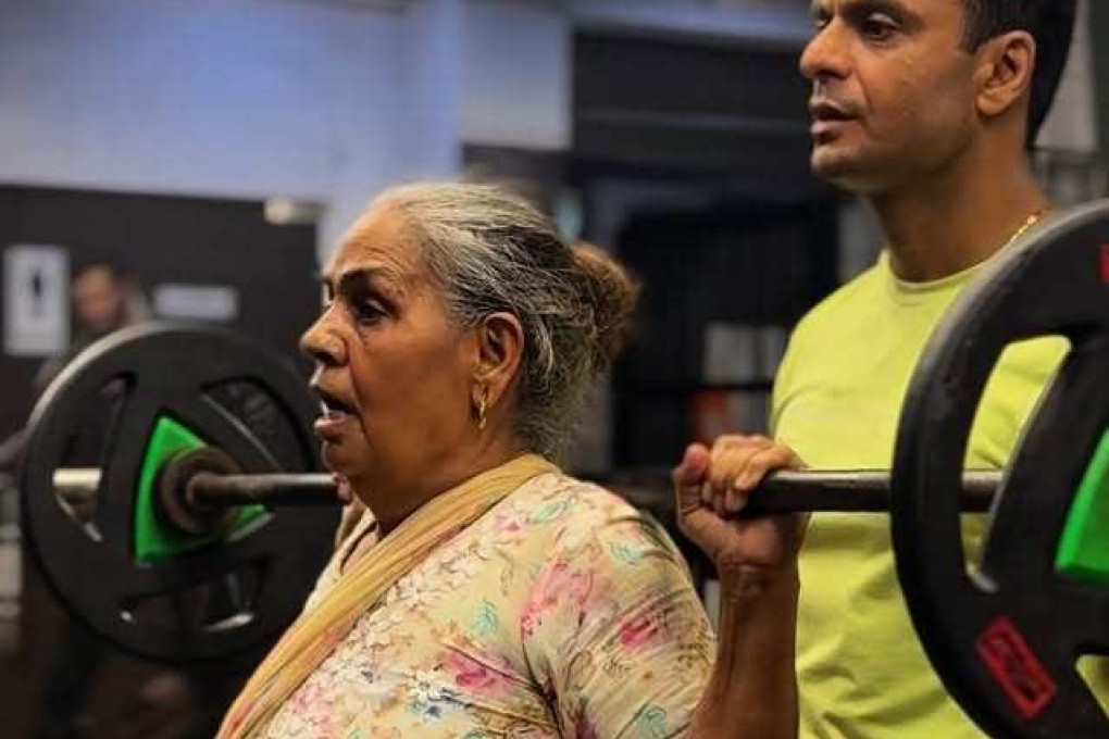 India’s “Weightlifter Mummy” Roshni Devi Sangwan trains with her son Ajay. In the last three years, the 70-year-old has gone from “weak and unmotivated” to deadlifting over 100kg and squatting 60kg. Photo: Instagram/weightliftermummy
