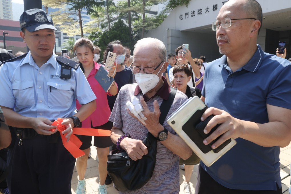 Ho Huen (centre) leaves Tuen Mun Court after an earlier appearance. Photo: Edmond So