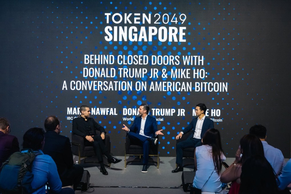 World Liberty Financial co-founder Donald Trump Jnr takes centre stage at the Token2049 event in Singapore on Wednesday. He is flanked by entrepreneur Mario Nawfal, left, and US Bitcoin Corp CEO Mike Ho. Photo: Token2049