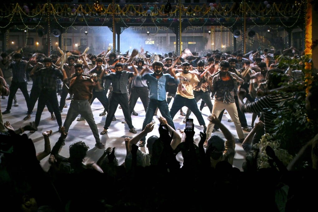 Fans dance inside a cinema during the screening of Indian actor Rajinikanth’s new Tamil-language movie “Coolie” on the first day of its release in Mumbai on August 14. Photo: AFP