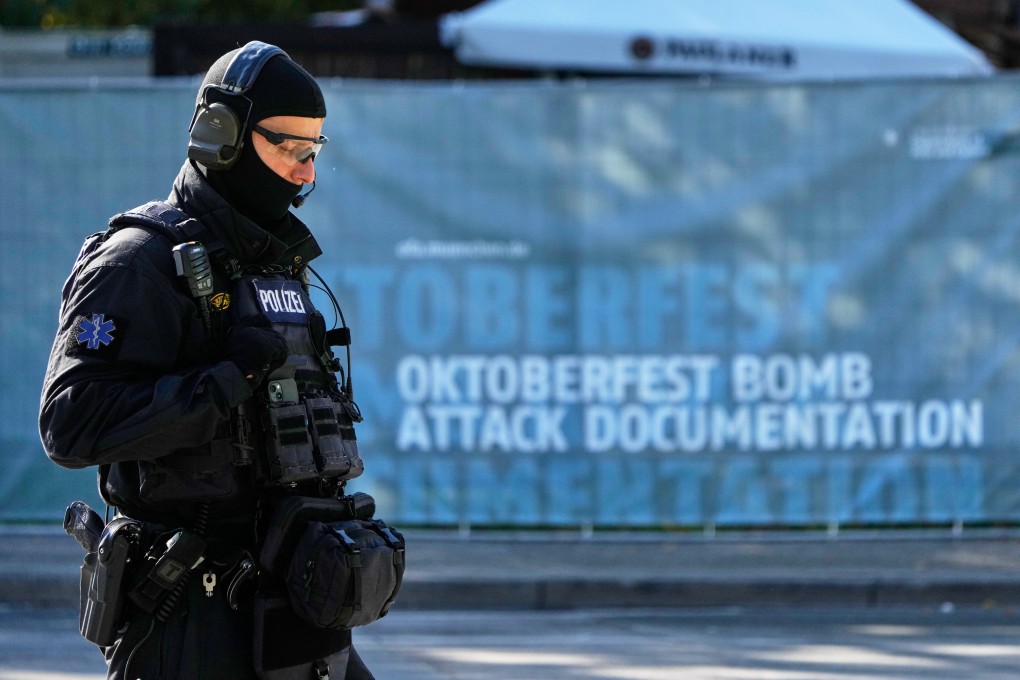An officer patrols near the closed Oktoberfest area in Munich, Germany, on Wednesday after police discovered explosives in a nearby residential building. Photo: AP