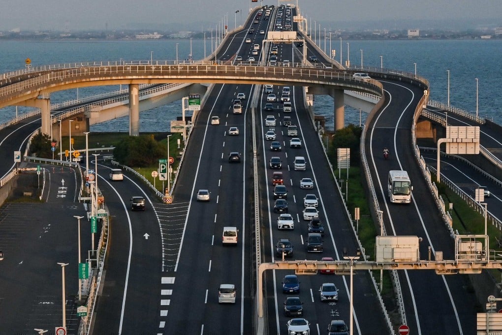 Cars travel from a bridge into the tunnel section entrance at Umihotaru, a man-made island designed as a parking area. Photo: AFP
