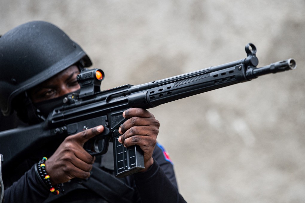A Haitian police officer patrols in Kenscoff, a suburb of Port-au-Prince. Photo: AFP