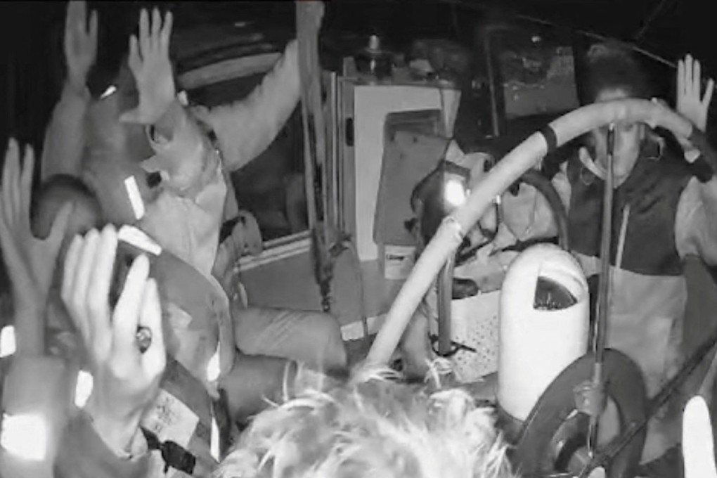 A screengrab from a live stream shows crew of a vessel that is part of the Global Sumud Flotilla raise their hands as they are surrounded by Israel Defence Forces on Thursday. Photo: Global Sumud Flotilla/Reuters