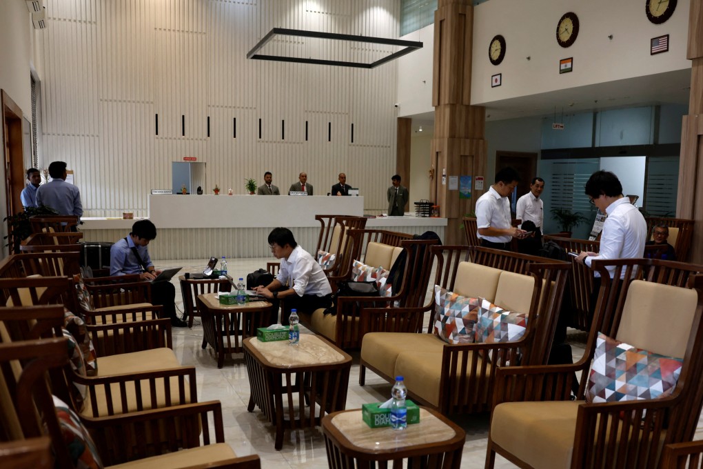 Japanese expats sit in the lobby of the AJU Imperial hotel in Vithalapur, Gujarat, India, on August  26. Photo: Reuters