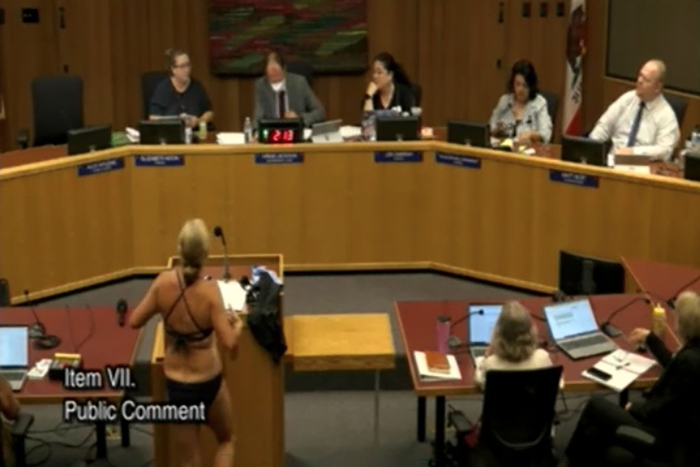 Beth Bourne removes her clothes at the Sept. 18, 2025, Davis Joint Unified School District board meeting in protest of the district’s bathroom and locker room policies. (Davis Joint Unified School District/TNS)