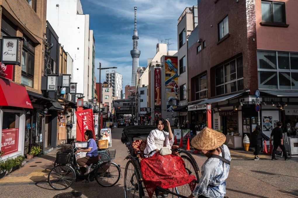 A tourist rides on a rickshaw in Tokyo’s Asakusa district. Photo: AFP