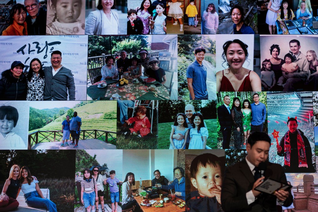 Photos of adoptees participating at the Overseas Korean Adoptees Gathering are projected on a screen. Photo: AP
