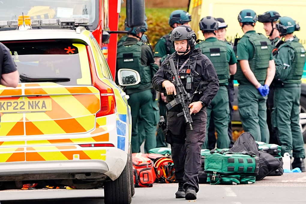 An armed police officer at the scene of a stabbing incident at a synagogue in Manchester, England on Thursday. Photo: AP
