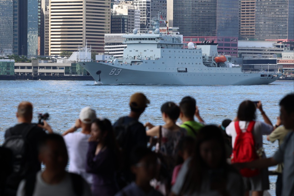 Crowds look on as the Qi Jiguang sails through Victoria Harbour on Friday. Photo: Jelly Tse