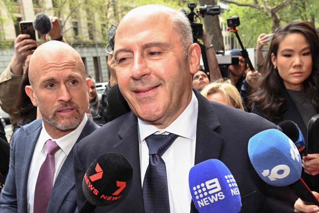 Melbourne gangland personality Tony Mokbel (centre) is mobbed by reporters after leaving the Victorian Court of Appeal in Melbourne on Friday. Photo: AFP