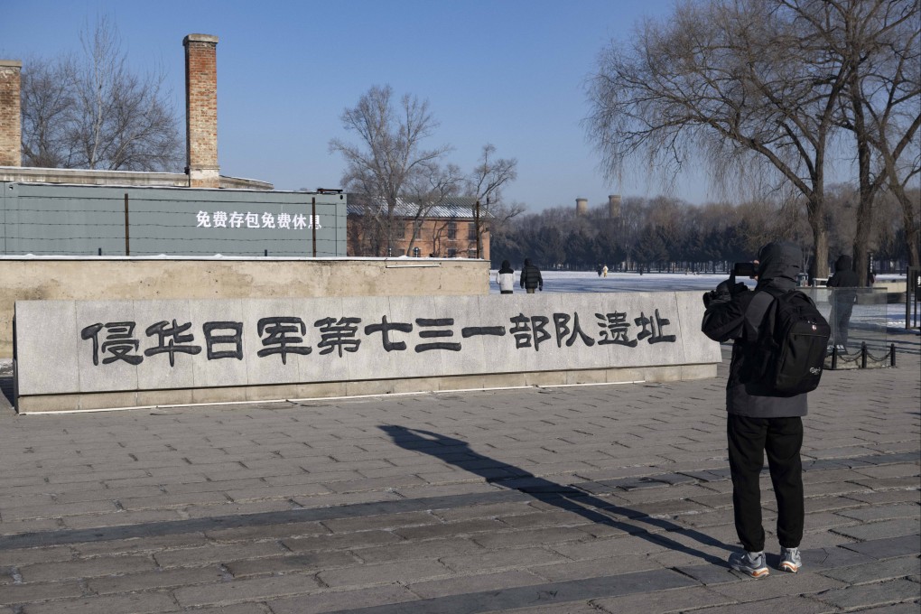 A visitor takes a photo at the entrance to the former site of Unit 731, a Japanese biological warfare unit during World War II, in China’s northeastern Heilongjiang province. Photo: Xinhua