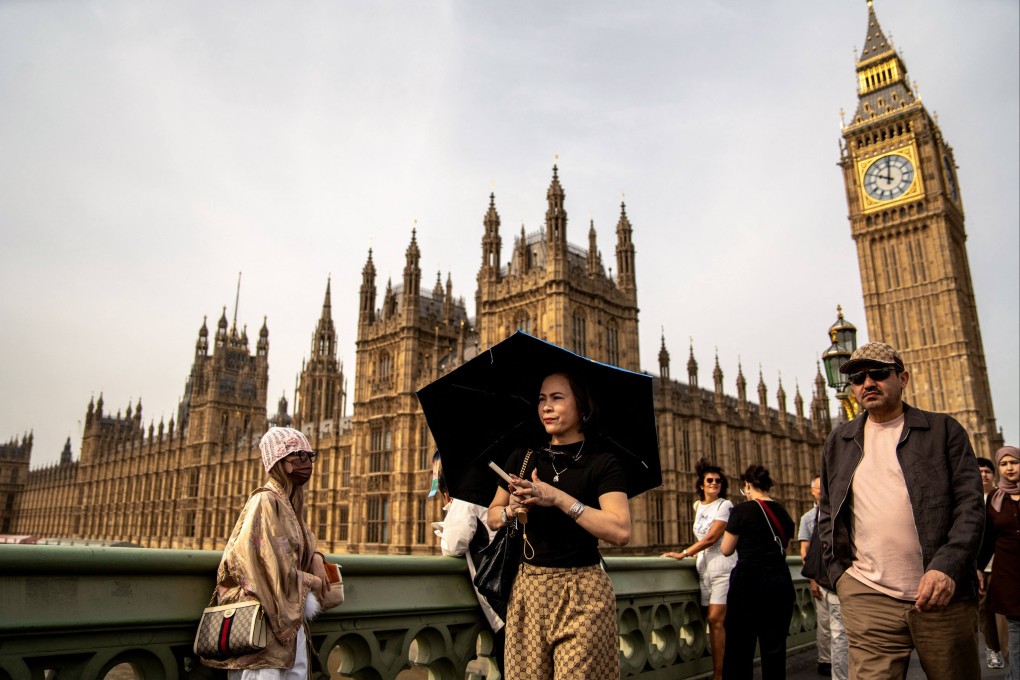 People walk by the Elizabeth Tower, more known as “Big Ben”, one of London’s notable landmarks. File photo: AFP