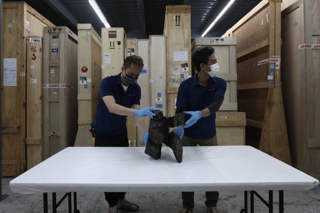 Workers at Christie’s warehouse in Tsing Yi. Photo: Jonathan Wong