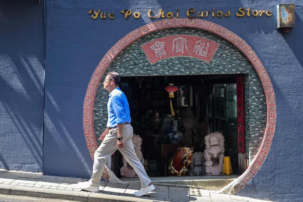 Financial Secretary Paul Chan strolls along Hollywood Road in the Mid-Levels during a recent “city walk.”  Photo: Handout